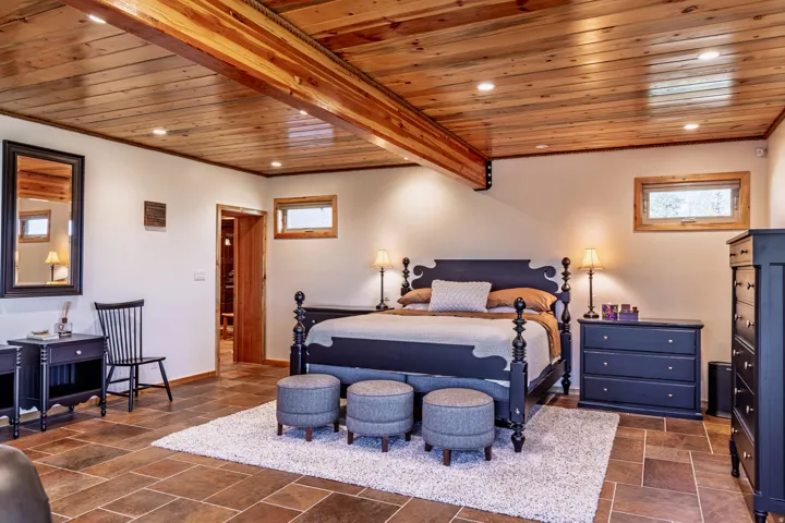 Wood plank ceiling with integrated recessed lighting