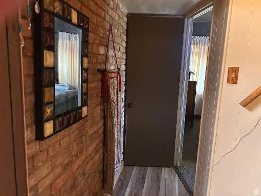 Exposed brick wall with decorative mirror