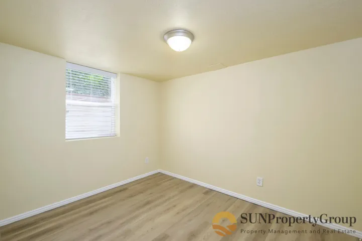 Neutral-toned walls with wood-finish flooring
