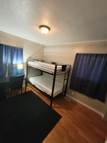 Hardwood-style flooring and neutral wall tones