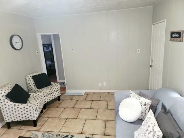 Tile flooring with light-toned wall paneling