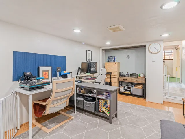 Recessed ceiling lighting, light wood-finish flooring, and a wide entryway