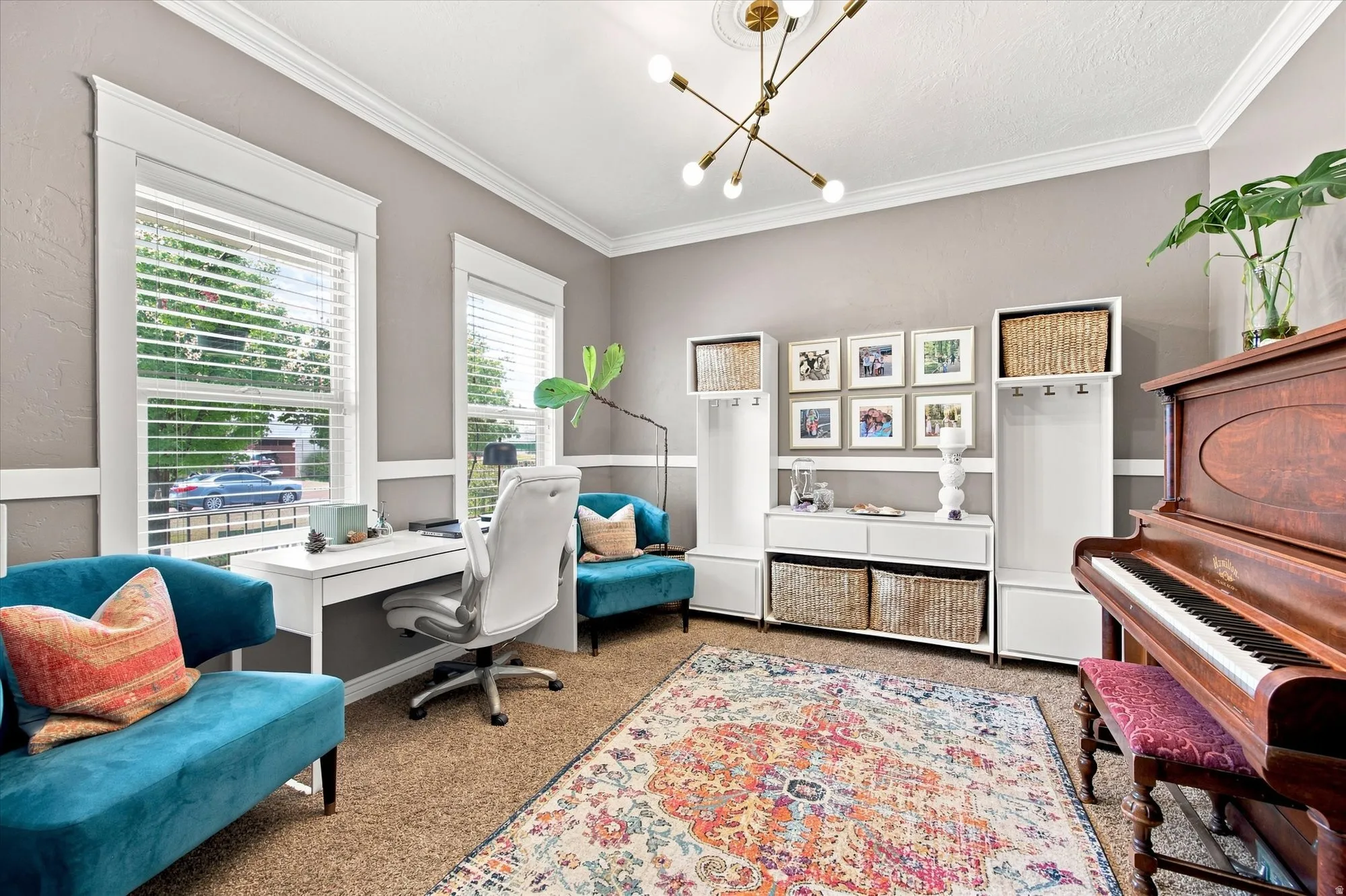 Recessed paneled wainscoting, crown molding, and a modern sputnik chandelier