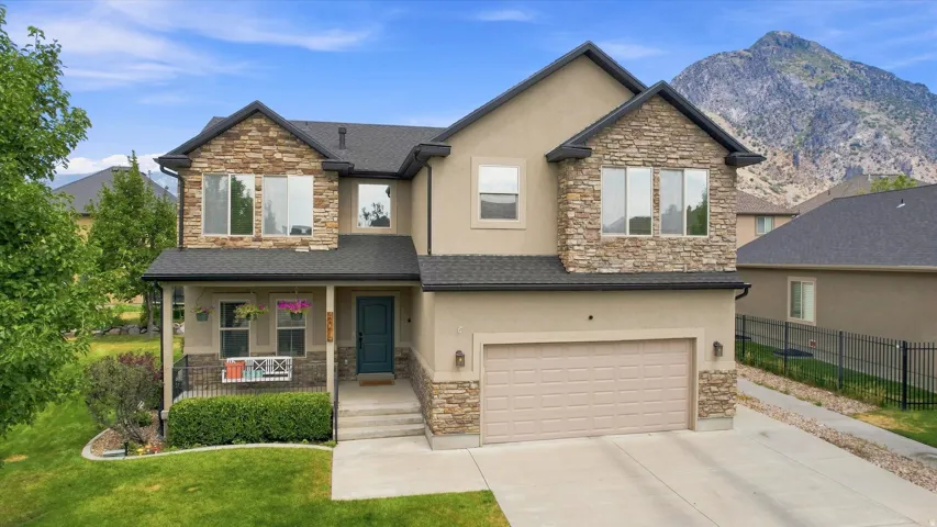 Two-story stucco and stone exterior