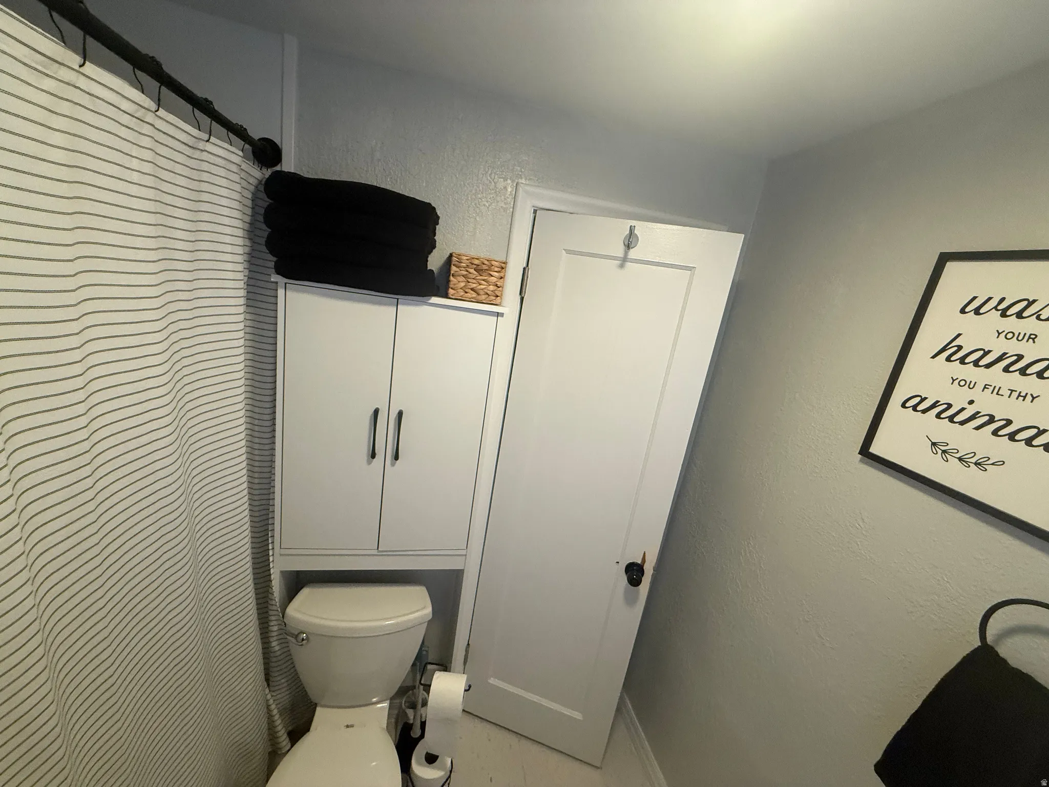White built-in cabinetry with dark hardware