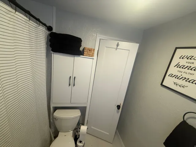 White built-in cabinetry with dark hardware