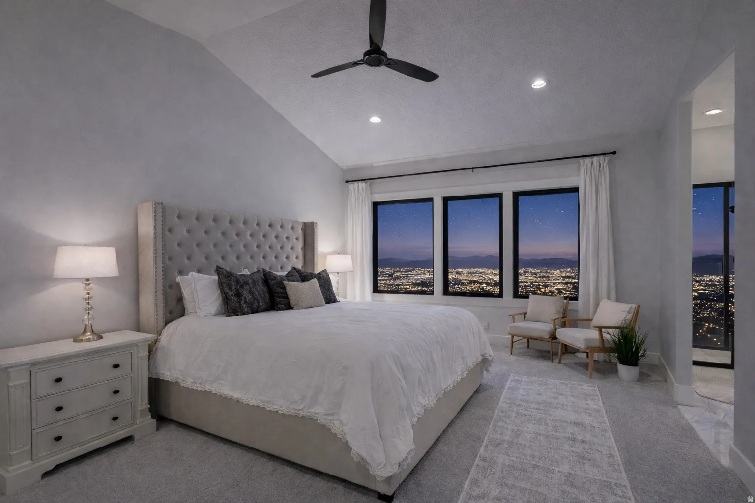 Vaulted ceiling with recessed lighting and ceiling fan