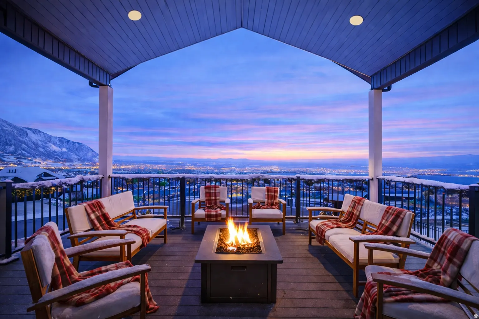 Expansive covered deck featuring a built-in fire pit, composite decking, and a metal railing system