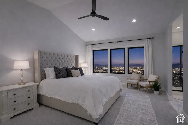 Vaulted ceiling with recessed lighting and ceiling fan