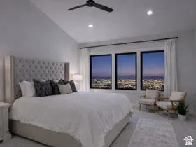 Vaulted ceilings with recessed lighting, black frame windows, and a ceiling fan