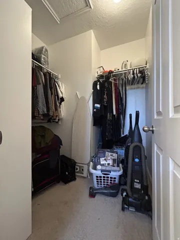 Main bedroom walk-in closet adjacent to the bathroom.