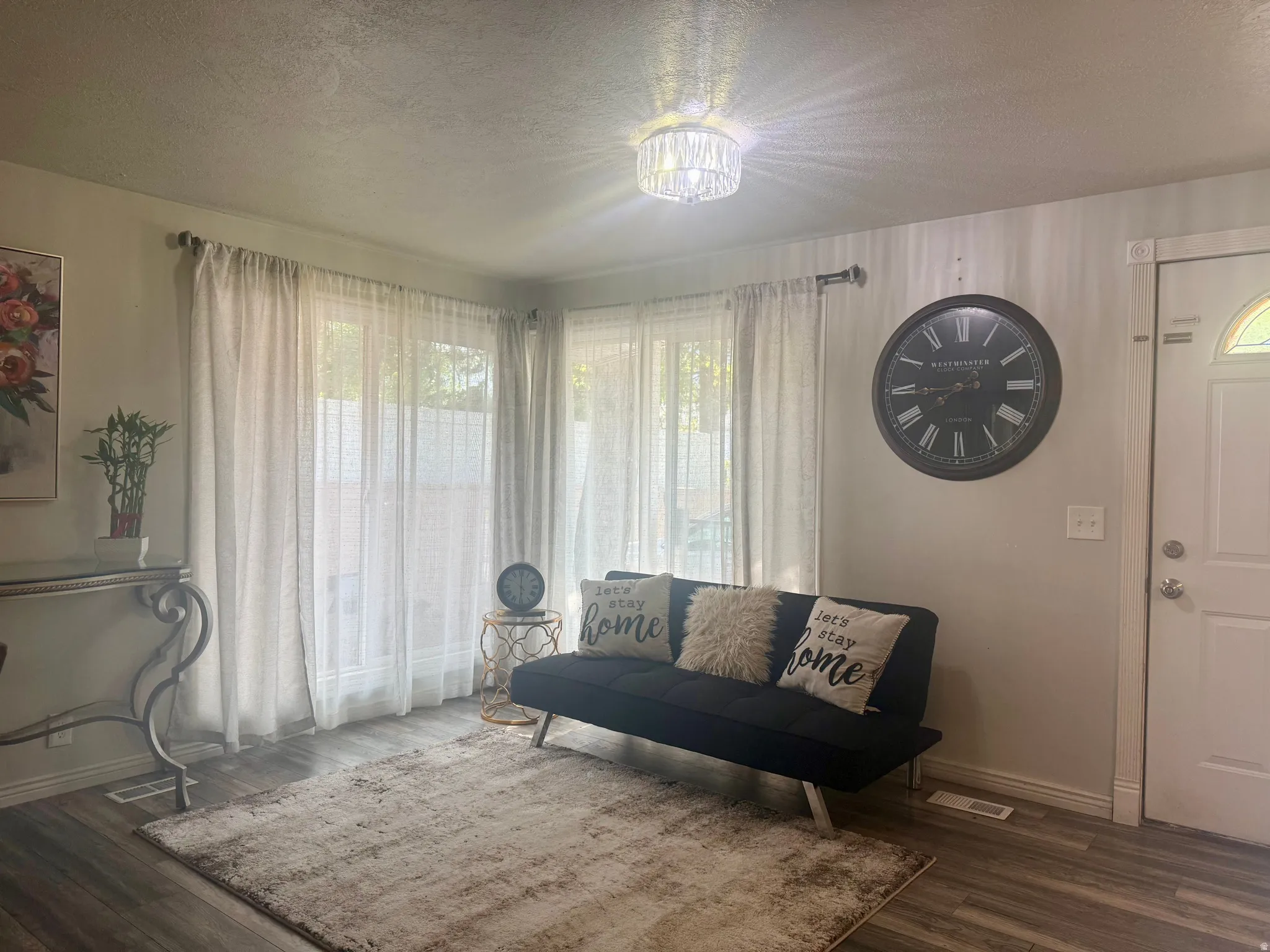Living room with wood-finish flooring throughout