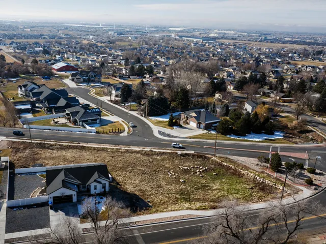 Aerial perspective showcasing a residential neighborhood with surrounding terrain