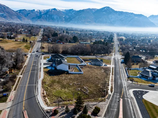 Expansive lot featuring mature landscaping and mountain scenery