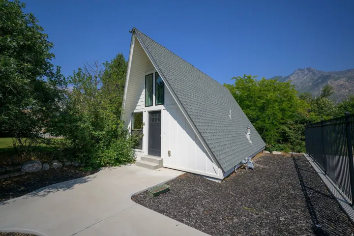 A-frame architectural style with a dark gray shingle roof