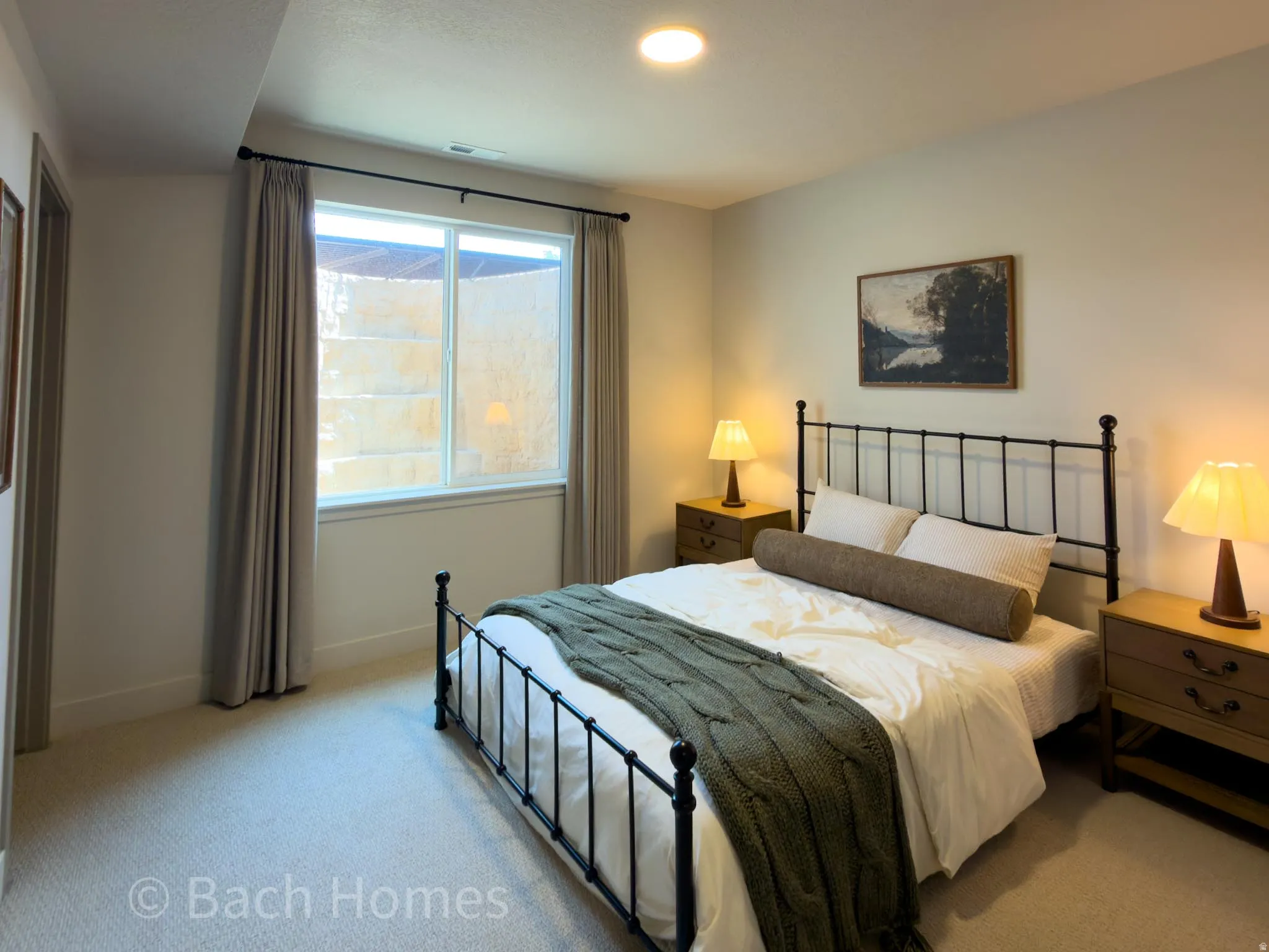 Recessed ceiling lighting, window with light-filtering curtains, light-toned wall paint, and wall-to-wall carpeting