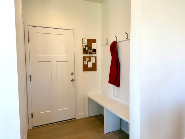 Entryway with light wood-finish flooring