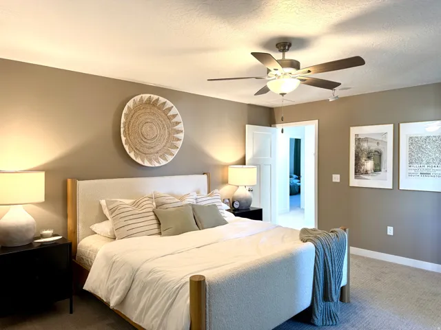 Neutral-toned room featuring warm wall paint and light-colored carpeting