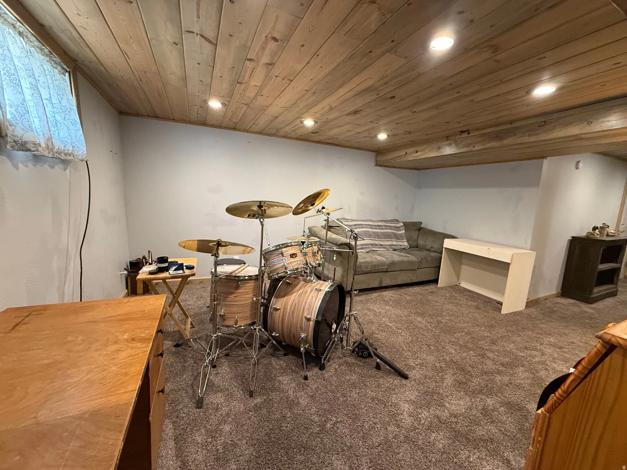 Wood-paneled ceiling with recessed lighting