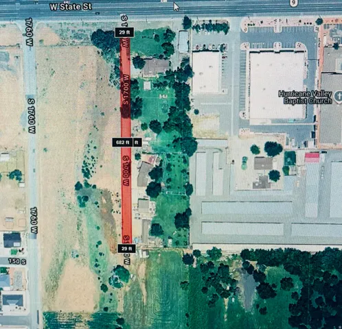 Aerial Property Survey. Depicting the property boundaries, improvements, vegetation coverage, and surrounding land parcels with dimensional measurements