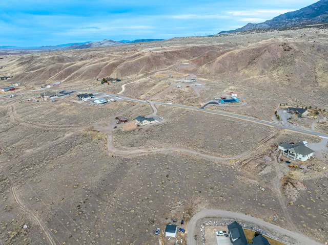Expansive arid landscape with scattered residential structures