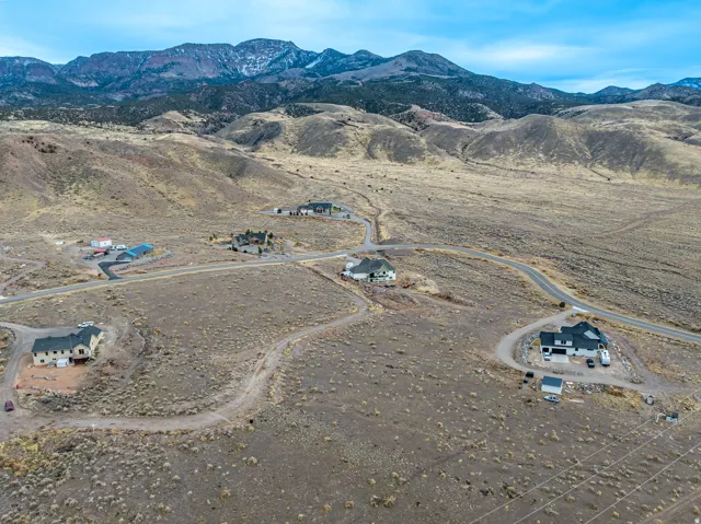 Expansive mountainous landscape with multiple residential properties