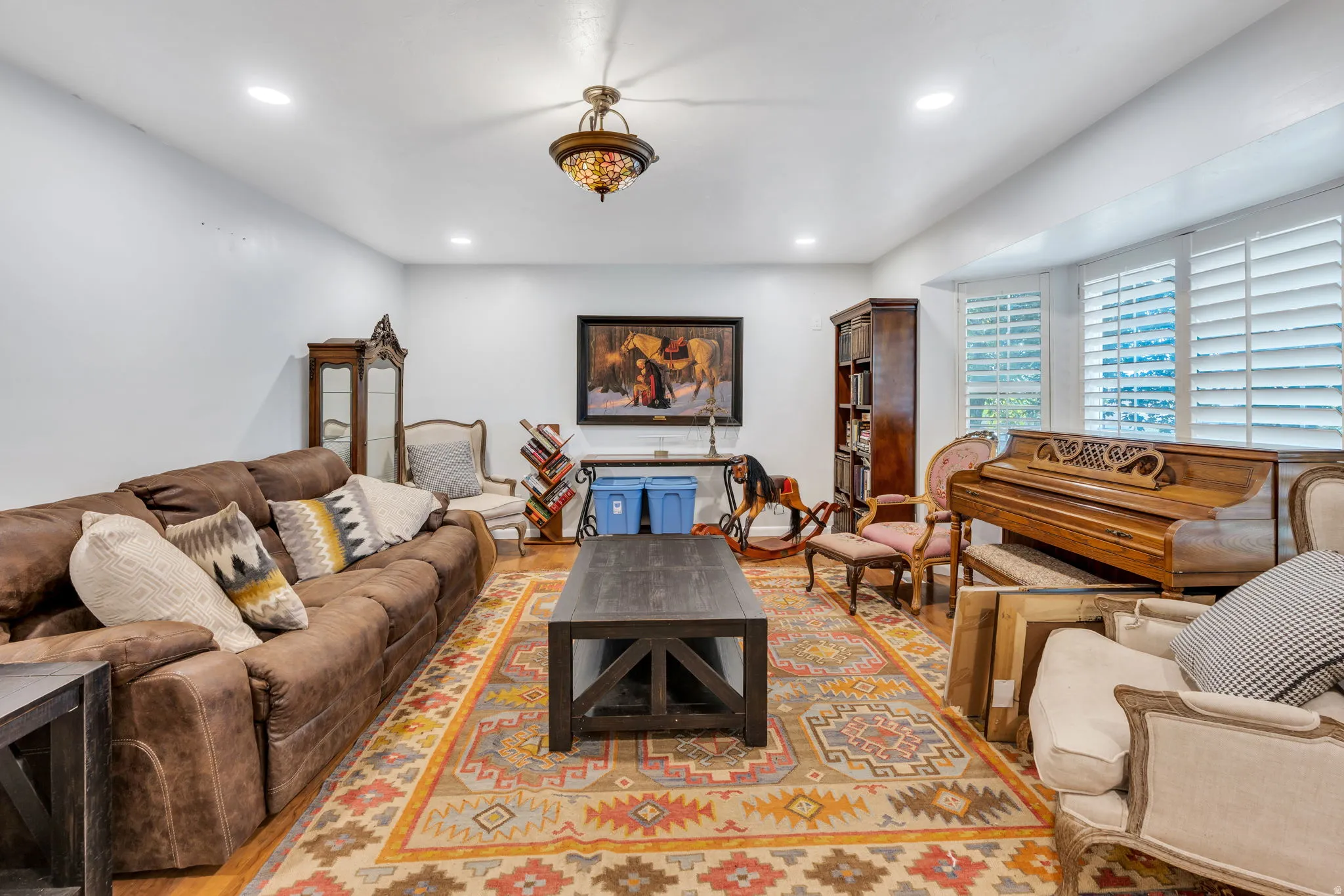 Recessed lighting, wood-finish flooring, and crown molding