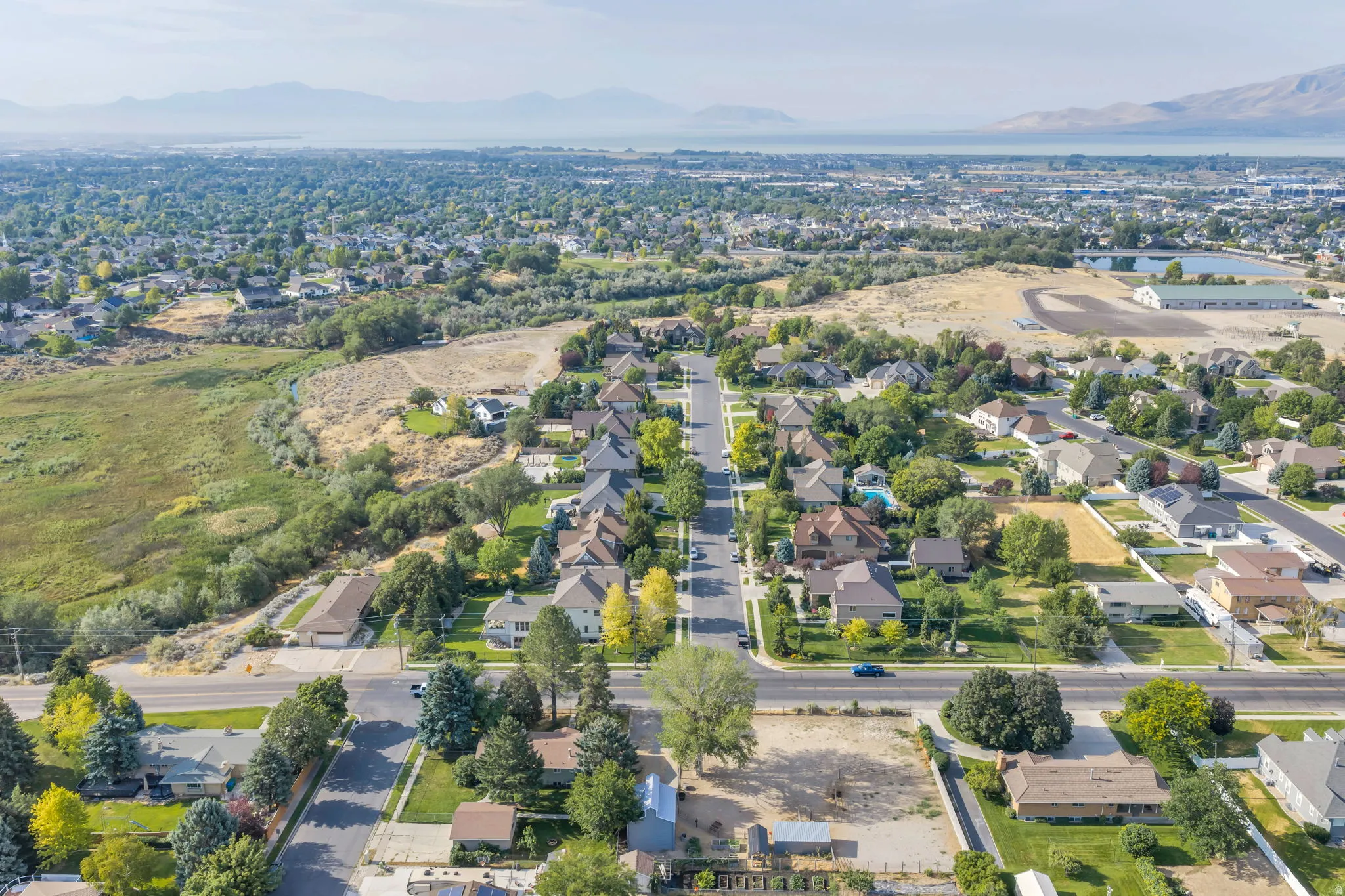 Residential neighborhood featuring a grid street pattern and mature tree cover