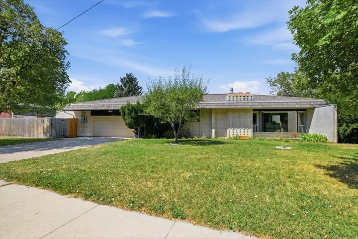 Mid-century modern single-story residence showcasing a clean linear design with horizontal architectural lines