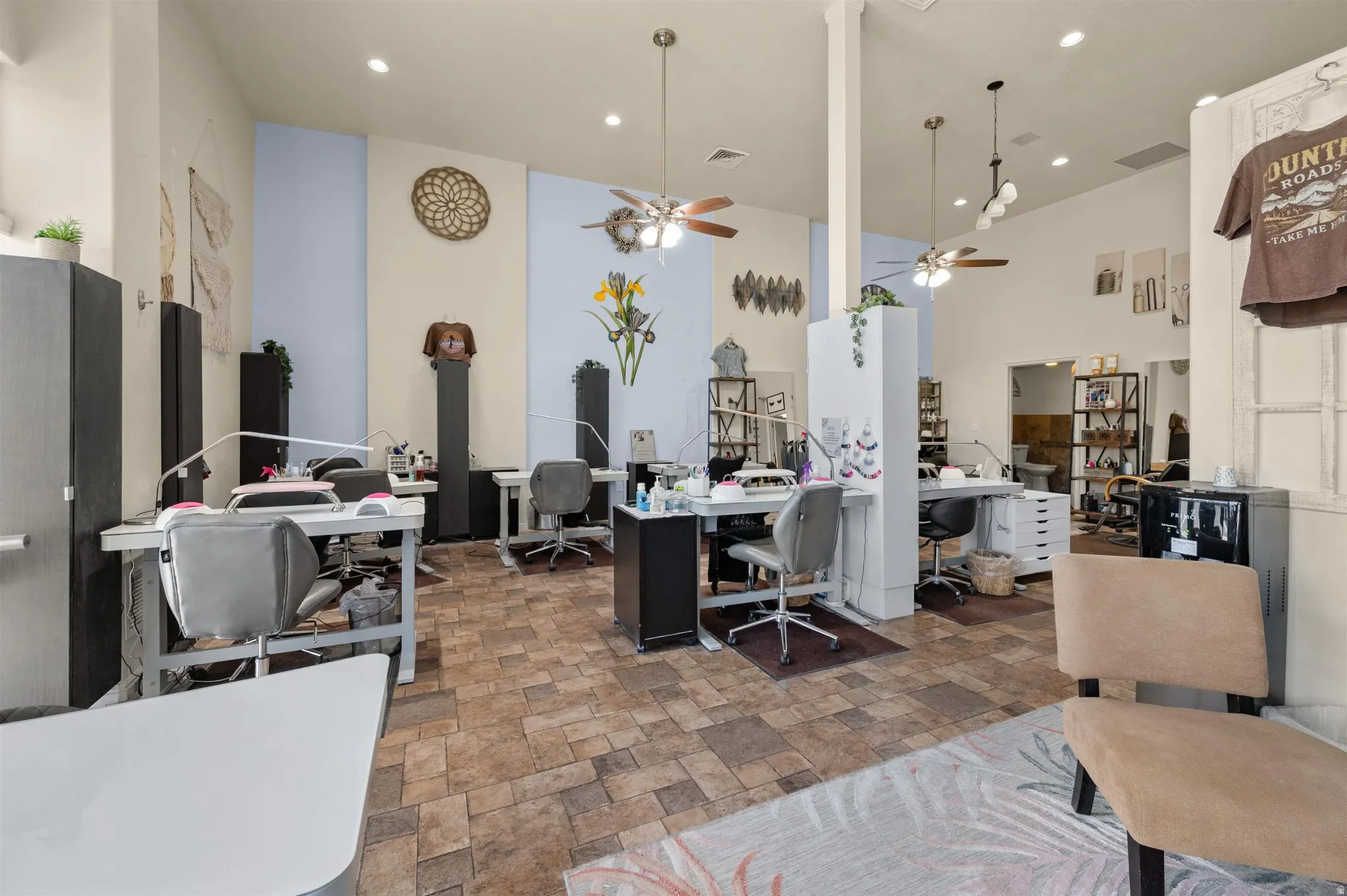Recessed lighting, ceiling fans with integrated lighting, and multiple Nail workstations