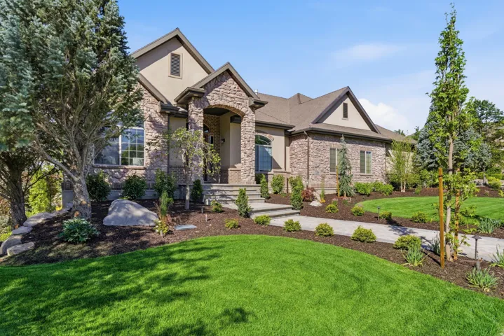 Elegant brick and stone exterior with multiple gabled rooflines and architectural detail