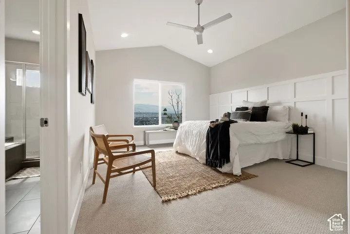 Vaulted ceiling with recessed lighting and a ceiling fan