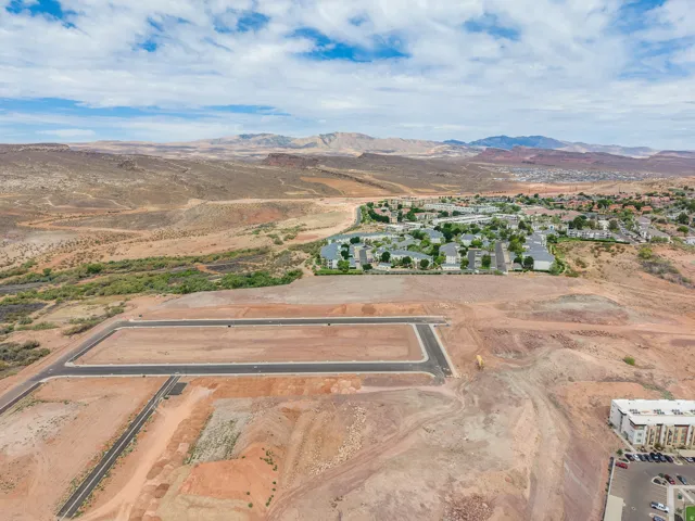 Expansive land parcel featuring established roads and utility infrastructure