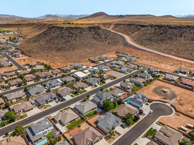 Newly developed residential community featuring modern homes with contemporary architectural design, mature landscaping, and paved streets