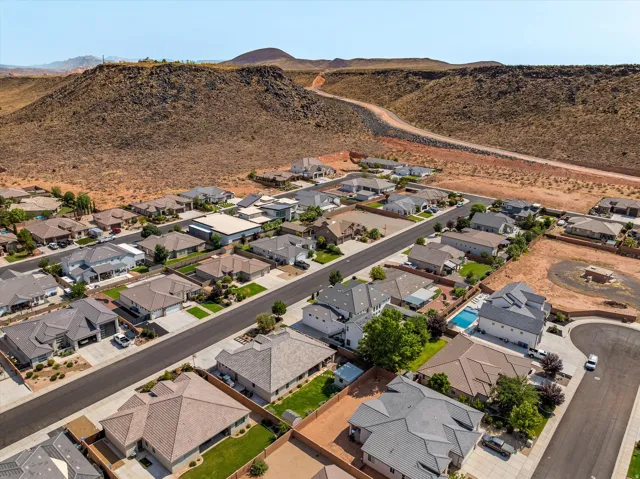 Newly developed residential community featuring modern single-family homes with architectural consistency, mature landscaping, and paved streets