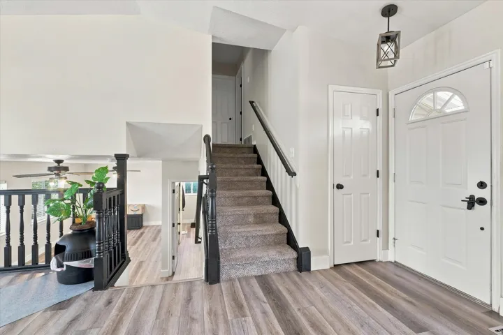 Two-story entryway with wood-finish flooring