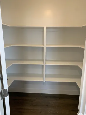 Built-in shelving, durable wood-finish flooring, and crisp white trim