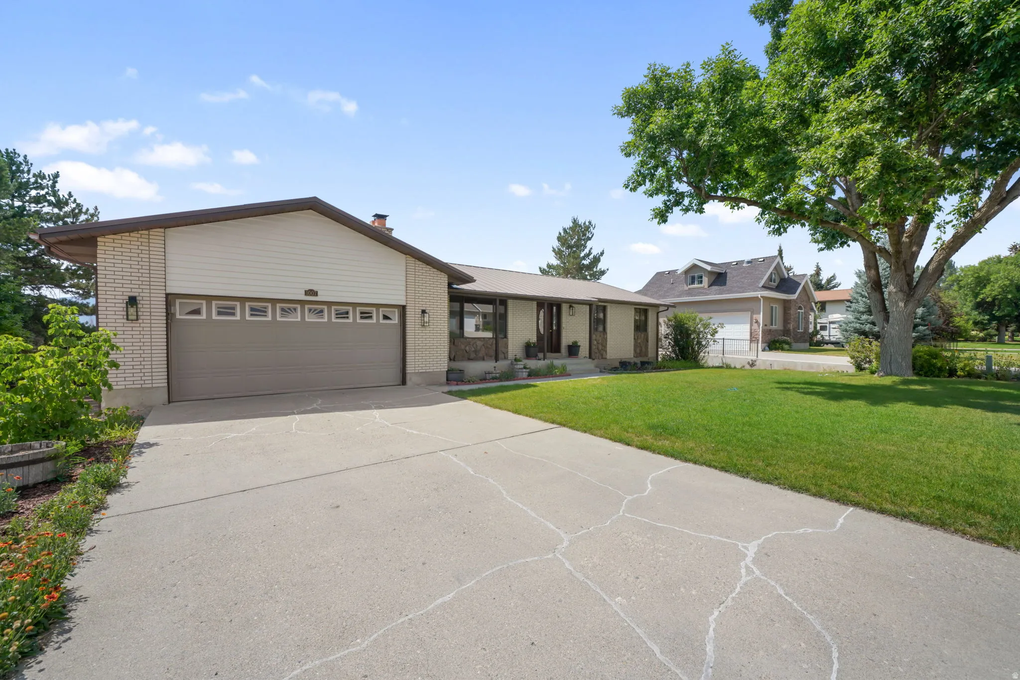 Concrete driveway leading to an attached two-car garage.