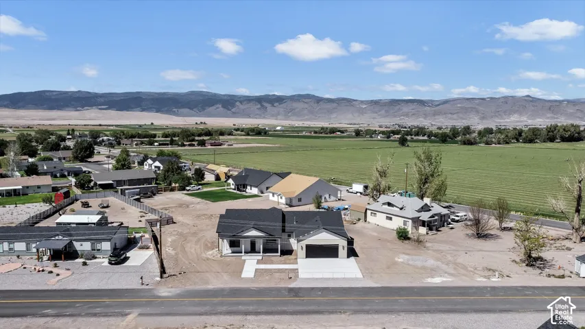 Newly constructed residence featuring an attached two-car garage, covered porch, and concrete driveway