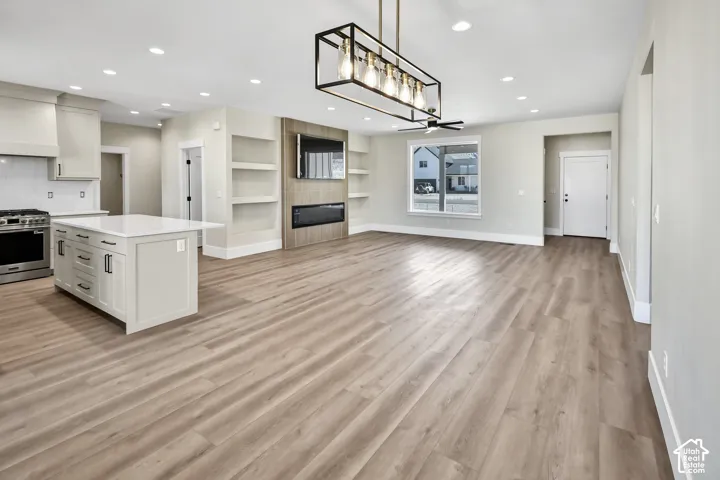 Kitchen island with a white countertop and dark hardware