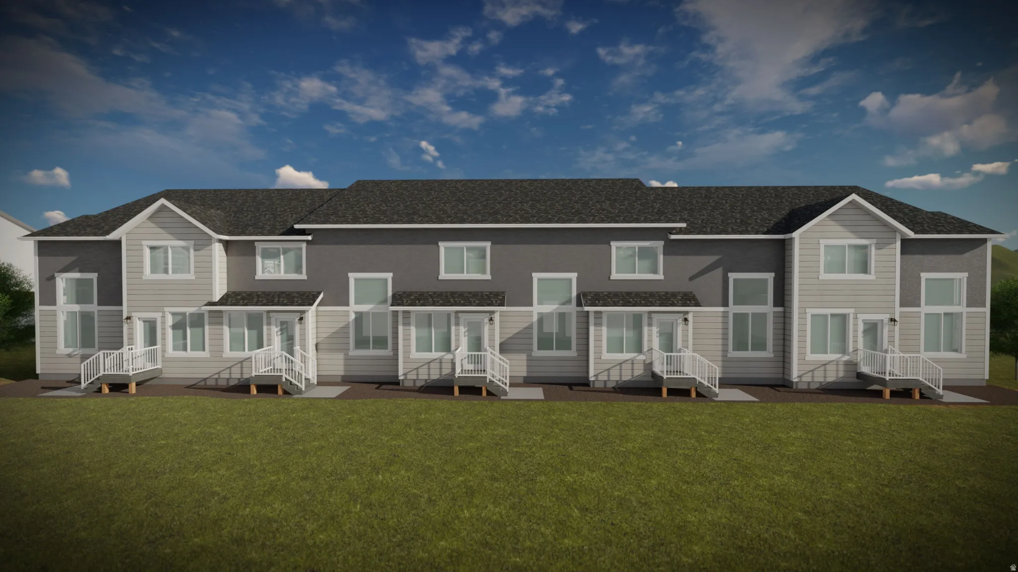 Charming multi-unit townhome community featuring consistent architectural styling with peaked rooflines, individual front porches with railings, and coordinated siding and trim finishes