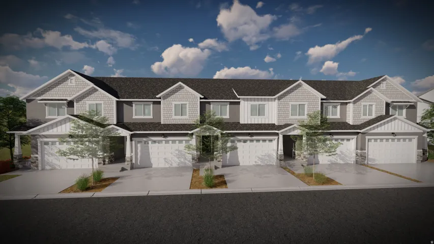 Modern townhome community featuring clean-lined architectural design with mixed exterior finishes, multi-car garages, and mature landscaping throughout the streetscape