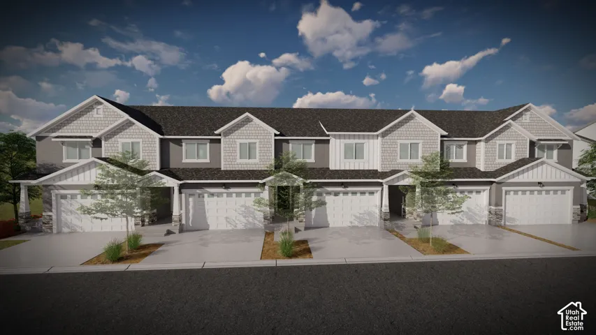 Modern townhome community featuring clean-lined architectural design with mixed exterior finishes, multi-car garages, and mature landscaping throughout the streetscape