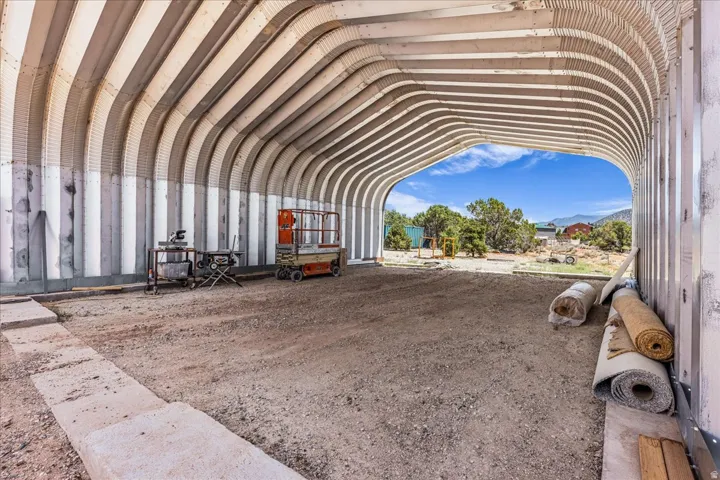Arched metal structure with a gravel floor