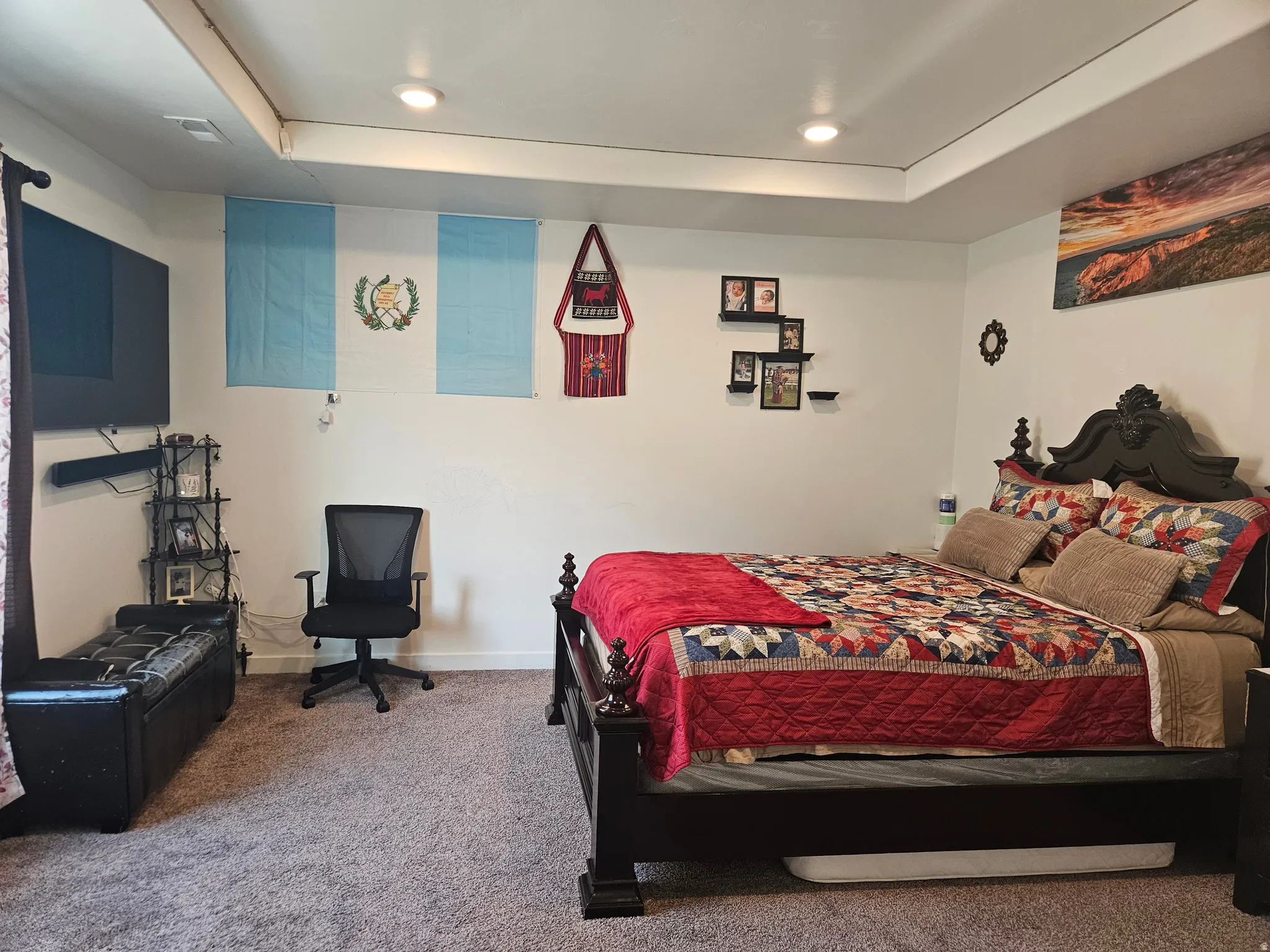 Tray ceiling with recessed lighting, wall-to-wall carpeting, and neutral paint palette