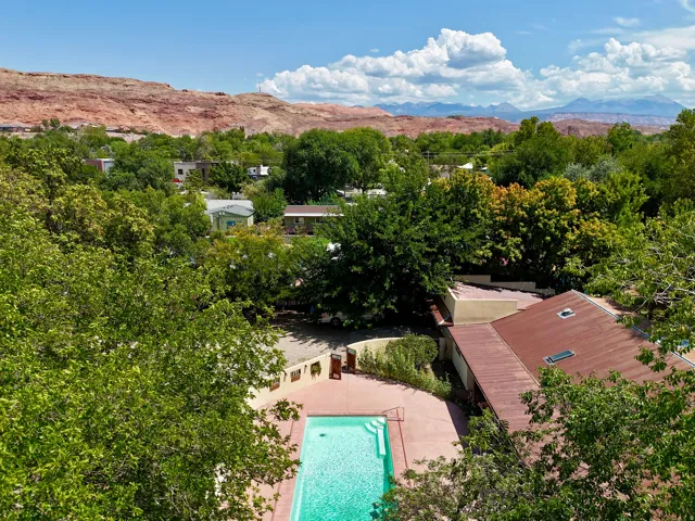 Terraced outdoor pool area with surrounding hardscaping