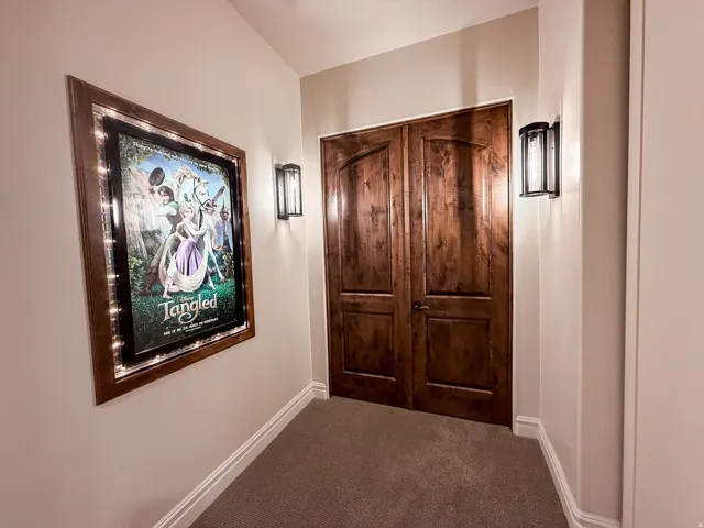 Arched panel wood doors complemented by matching wood trim