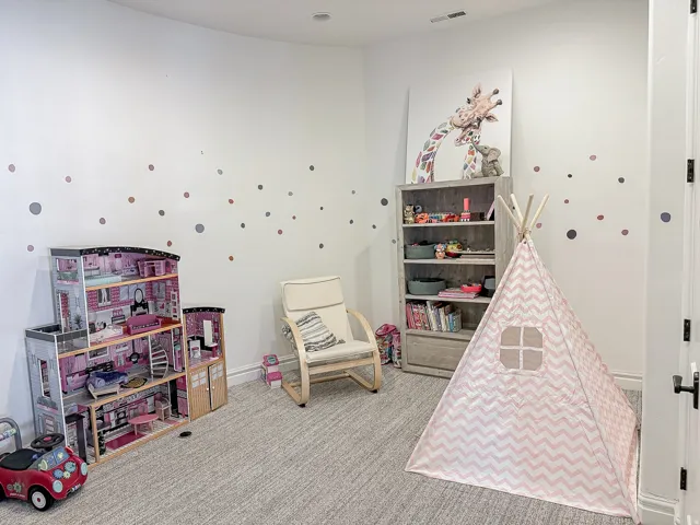 Recessed ceiling lighting, light-toned wall finishes, light gray carpet flooring, and white trim