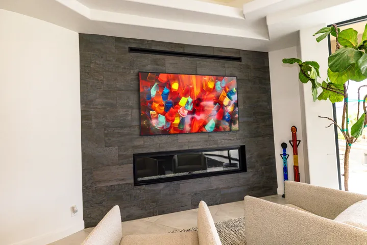 Stone-clad accent wall with an integrated linear electric fireplace