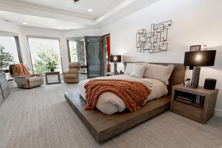 Expansive room with recessed lighting and a tray ceiling